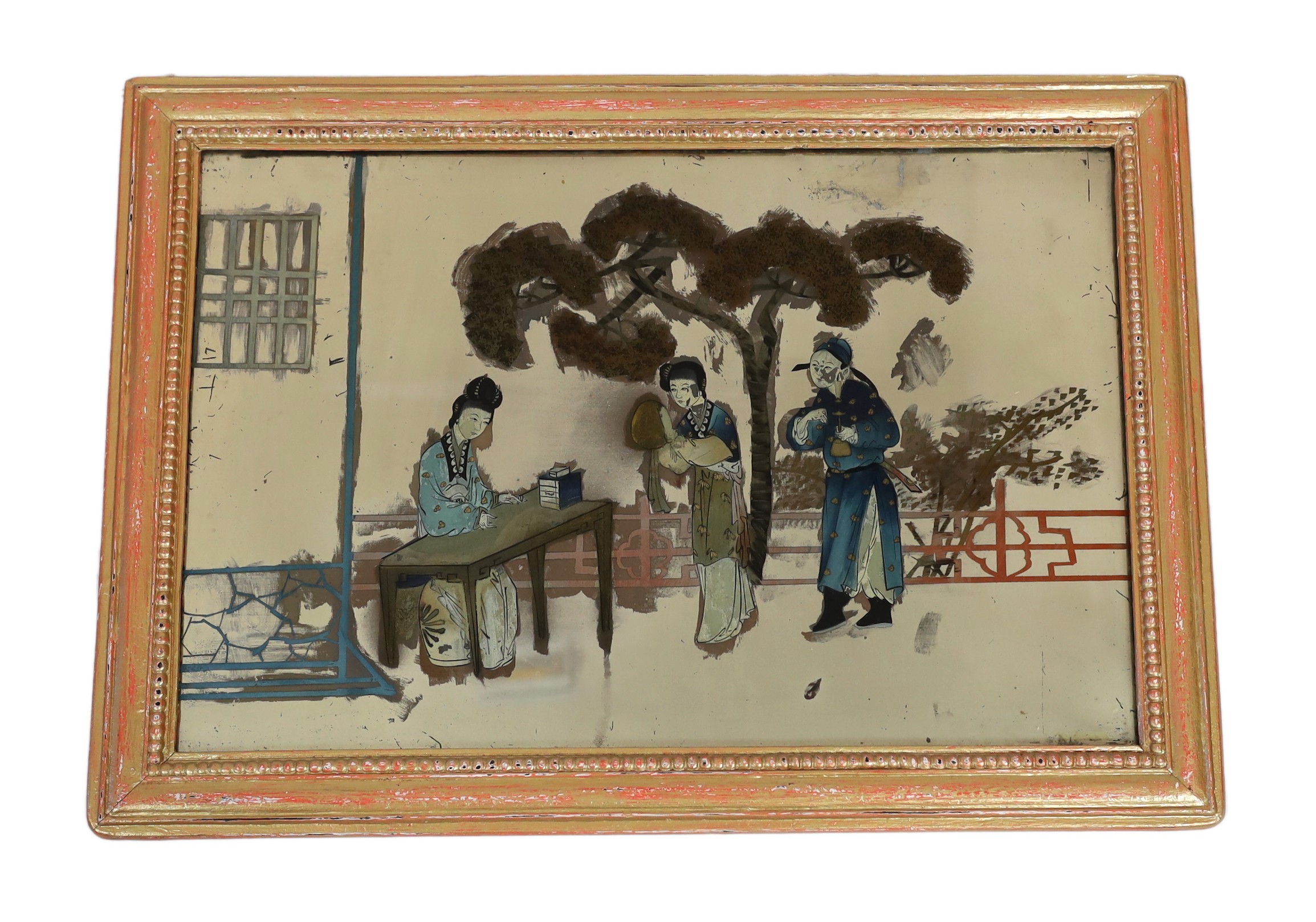 A 19th century Chinese reverse painted glass mirror, depicting a female scholar and figures in a garden, 38 x 59cm, in a period gilt frame